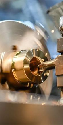 High-precision CNC lathe machining a metal part at high speed